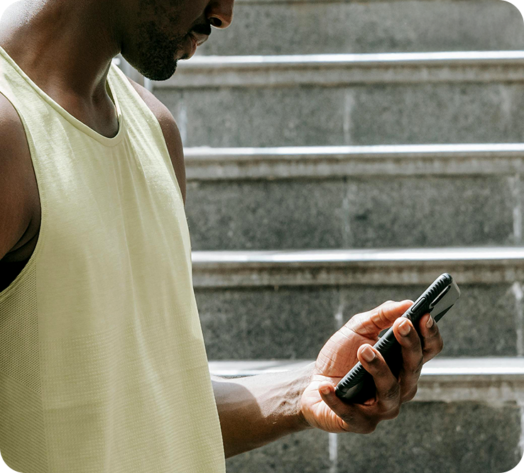 A person checking their phone after training